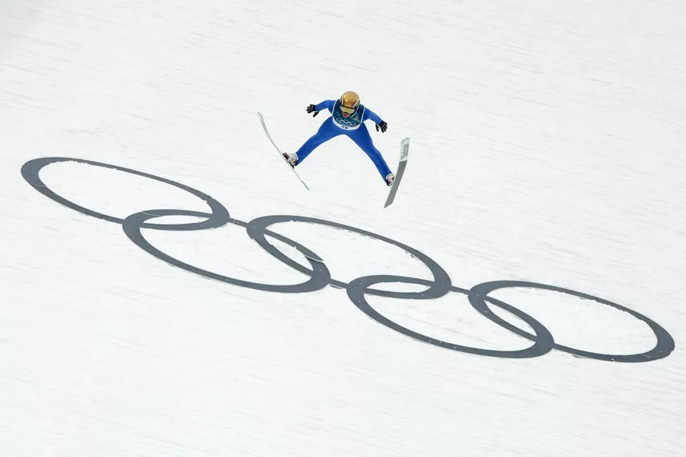 Milano Cortina 2026 Olympics - Nordic Combined - Individual Gundersen Normal Hill/10km, Ski Jumping Trial Round - Predazzo Ski Jumping Stadium, Predazzo, Italy - February 11, 2026. Gasper Brecl of Slovenia in action during the ski jumping trial round REUTERS/Kai Pfaffenbach
