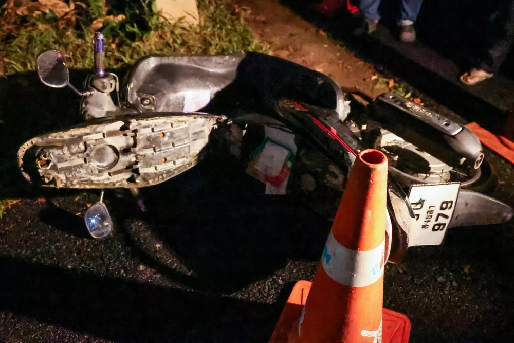 A motorbike near the gate of the Patongprathankiriwat School, which, according to police, is believed to belong to the gunman, after he entered and held an unknown number of students and teachers hostage, in southern Thailand's Songkhla, Thailand, February 11, 2026. REUTERS/Roylee Suriyaworakul