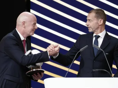 Soccer Football - 50th Ordinary UEFA Congress - Brussels Expo, Brussels, Belgium - February 12, 2026 UEFA president Aleksander Ceferin and FIFA president Gianni Infantino shake hands during the event REUTERS/Benoit Tessier