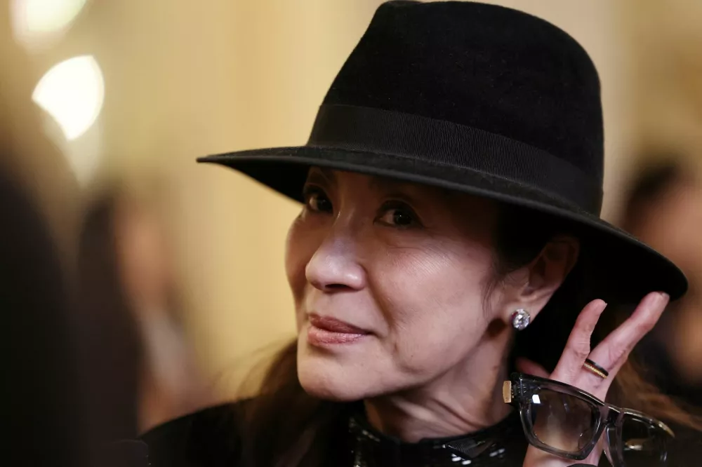 FILE PHOTO: Milano Cortina 2026 Winter Olympics - Red Carpet at La Scala - Teatro La Scala, Milan, Italy - February 6, 2026 Actress Michelle Yeoh arrives for the La Scala event ahead of the opening ceremony of the Milano Cortina Games REUTERS/Amanda Perobelli/File Photo