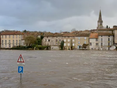 View of the Vienne river in Confolens as severe flooding hits western France amid storm Nils, Thursday, Feb. 12, 2026. (AP Photo/Yohan Bonnet)