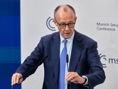 Germany's Chancellor Friedrich Merz prepares to address the audience during the Munich Security Conference in Munich, Germany, Friday, Feb. 13, 2026. (AP Photo/Michael Probst)
