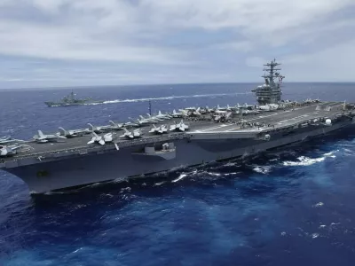 The USS Nimitz, a nuclear-powered aircraft carrier which is currently supplemented by biofuel, sails about 150 miles north of the island of Oahu during the RIMPAC Naval exercises off Hawaii in this file photo from July 18,2012. The Nimitz and four other ships in its strike group moved into the Red Sea early September 1, 2013, U.S. defense officials said, describing the move as "prudent planning" in case the ships are needed for military action against Syria. REUTERS/Hugh Gentry/Files (UNITED STATES - Tags: MILITARY ENERGY BUSINESS MARITIME ENVIRONMENT)