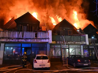 This image released on Friday, Feb. 13, 2026 by Hungary's National Directorate General for Disaster Management shows firefighters working to extinguish a fire that authorities in Hungary say left people dead and injured in Budakeszi, a suburb of the capital Budapest. (Hungary's National Directorate General for Disaster Management via AP)