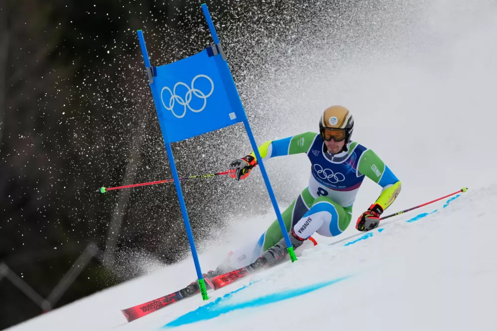 Slovenia's Zan Kranjec speeds down the course, during an alpine ski, men's giant slalom race, at the 2026 Winter Olympics, in Bormio, Italy, Saturday, Feb. 14, 2026. (AP Photo/John Locher)