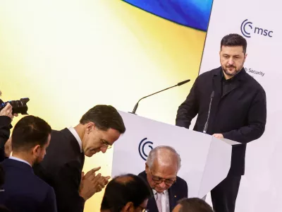 NATO Secretary General Mark Rutte and the chairman of the Munich Security Conference Wolfgang Ischinger in front of Ukrainian President Volodymyr Zelenskiy as he delivers a speech during the Munich Security Conference (MSC) in Munich, Germany, February 14, 2026. REUTERS/Liesa Johannssen