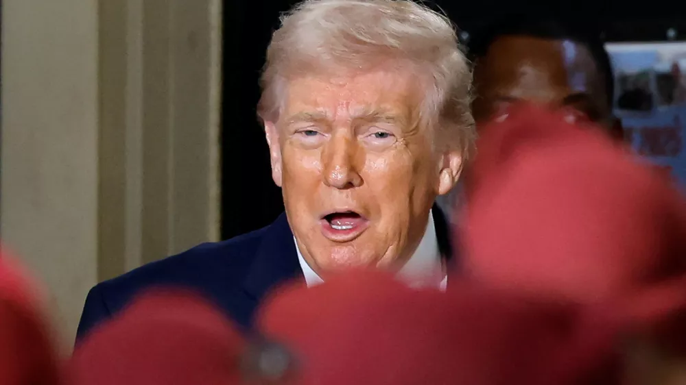 FILE PHOTO: U.S. President Donald Trump reacts during a visit at Fort Bragg, North Carolina, U.S., February 13, 2026. REUTERS/Jonathan Drake/File Photo