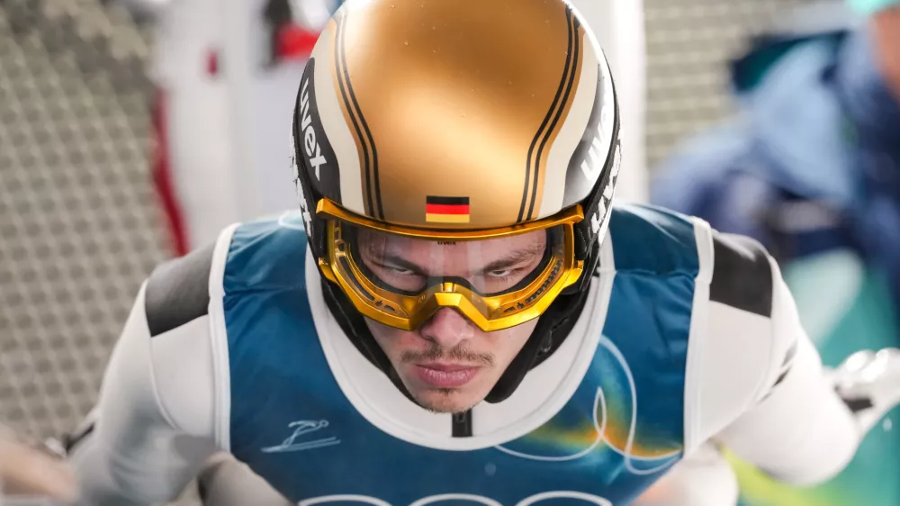 Philipp Raimund, of Germany, rehearses a jump during the ski jumping men's large hill individual at the 2026 Winter Olympics, in Predazzo, Italy, Saturday, Feb. 14, 2026. (AP Photo/Evgeniy Maloletka)