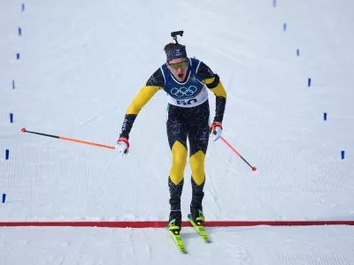 Martin Ponsiluoma, of Sweden, crosses the finish line of the men's 10-kilometer sprint biathlon race at the 2026 Winter Olympics in Anterselva, Italy, Friday, Feb. 13, 2026. (AP Photo/Andrew Medichini)