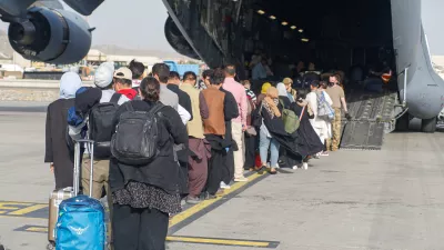 Evacuees assemble before boarding a C-17 Globemaster III during an evacuation at Hamid Karzai International Airport, Afghanistan, August 18, 2021. Picture taken August 18, 2021. U.S. Marine Corps/Lance Cpl. Nicholas Guevara/Handout via REUTERS THIS IMAGE HAS BEEN SUPPLIED BY A THIRD PARTY.