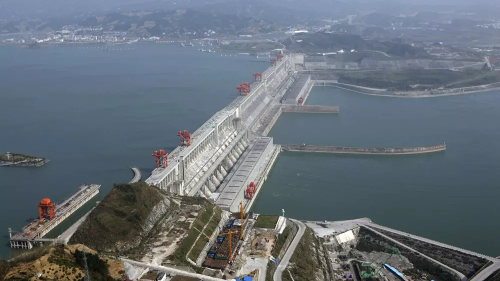 The Three Gorges Dam on the Yangtze River in Yichang, Hubei province is seen in this December 2, 2009 file photo. China's landmark Three Gorges Dam project provides benefits to the Chinese people, but has created a myriad of urgent problems from the relocation of more than a million residents to risks of geological disasters, the Chinese government said on Thursday. The statement from China's State Council, or cabinet, marked a rare acknowledgment of the issues that have shadowed the world's largest dam, an engineering feat designed to tame the Yangtze River that snakes from the Tibetan plateau to Shanghai. REUTERS/Stringer/Files (CHINA - Tags: ENVIRONMENT ENERGY BUSINESS) CHINA OUT. NO COMMERCIAL OR EDITORIAL SALES IN CHINA