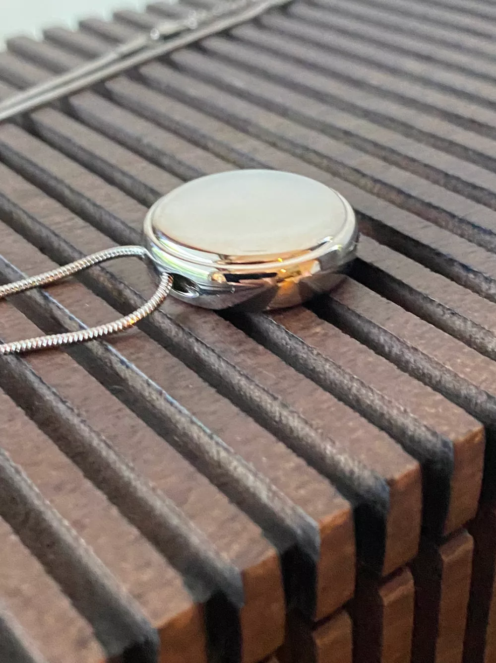 WORDS BYLINE: Hayley ChamberlainA new wearable necklace has been developed to help people monitor and protect their skin from everyday exposure to light.US startup Loox has revealed the Loox Pendant, which it claims is the world's first AI-powered device capable of tracking UV and visible light in real time.The pendant-style device has been created in response to mounting scientific evidence showing that more than 80% of visible skin ageing is caused by sun exposure. Developers say the goal is to bridge the gap between research and real-life behaviour, giving users personalised insights they can act on day to day.Worn around the neck and positioned close to the face &ndash; the most exposed part of the body &ndash; the Loox Pendant continuously measures UV and light levels throughout the day. Its three core functions include daily exposure tracking, live UV and light readings, and detection of so-called "hidden UV" sources.These hidden sources can include light entering through windows or even indoor lighting, exposure many people don't realise they're getting. The device can also alert users if they're not getting enough sunlight, which plays a key role in overall skin health.Data collected by the pendant is processed using AI and combined with more than 24 personal and environmental factors, including skin type, tone and sensitivity, UV index and cloud coverage. From this, the device delivers six tailored insights: Morning Sunlight, UV Protection, Hidden UV Protection, UV Balance, UV Recovery and Evening Light.According to the company, this allows the pendant to adapt to each user's lifestyle and surroundings, helping them decide when it's time to apply SPF &ndash; and when it may not be necessary.The hardware itself features ultra-sensitive, wide-angle UV and visible light sensors capable of detecting even very low levels of exposure. Despite its technical focus, Loox has leaned heavily into aesthetics, designing the pendant as a fashion-forward accessory made from premium materials.The wearable is water and dust resistant, comes with an adjustable neck strap and supports wireless charging. A single charge is said to last up to seven days.Loox says its broader mission is to "redefine the relationship with light" and help users harness its effects for better long-term health and longevity.The Loox Pendant will be available in SkySilver, JetBlack and SunGold finishes, with 15 different neck strap colour combinations. Pre-orders are set to open in early 2026, with deliveries expected by mid-2026.Prices will start from $179 (&pound;140) for limited Insider editions, which can be reserved now for $1 via the company's website.When: 16 Jan 2026Credit: Loox/INSTARimages**EDITORIAL USE ONLY. MATERIALS ONLY TO BE USED IN CONJUNCTION WITH EDITORIAL STORY. THE USE OF THESE MATERIALS FOR ADVERTISING, MARKETING OR ANY OTHER COMMERCIAL PURPOSE IS STRICTLY PROHIBITED. MATERIAL COPYRIGHT REMAINS WITH STATED PHOTOGRAPHER AND/OR SUPPLIER.**,Image: 1066513102, License: Rights-managed, Restrictions: EDITORIAL USE ONLY. MATERIALS ONLY TO BE USED IN CONJUNCTION WITH EDITORIAL STORY. THE USE OF THESE MATERIALS FOR ADVERTISING, MARKETING OR ANY OTHER COMMERCIAL PURPOSE IS STRICTLY PROHIBITED. MATERIAL COPYRIGHT REMAINS WITH STATED PHOTOGRAPHER AND/OR SUPP, Model Release: no