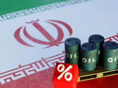 FILE PHOTO: Iranian flag and 3D printed oil barrels miniature are seen in this illustration taken June 23, 2025. REUTERS/Dado Ruvic/Illustration/File Photo