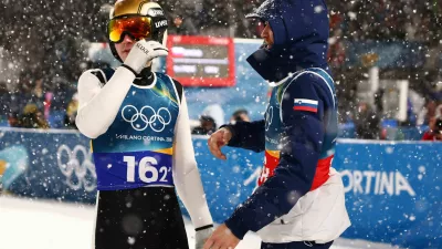 Milano Cortina 2026 Olympics - Ski Jumping - Men's Super Team - Predazzo Ski Jumping Stadium, Predazzo, Italy - February 16, 2026. Domen Prevc of Slovenia and Anze Lanisek of Slovenia during the final round REUTERS/Kacper Pempel