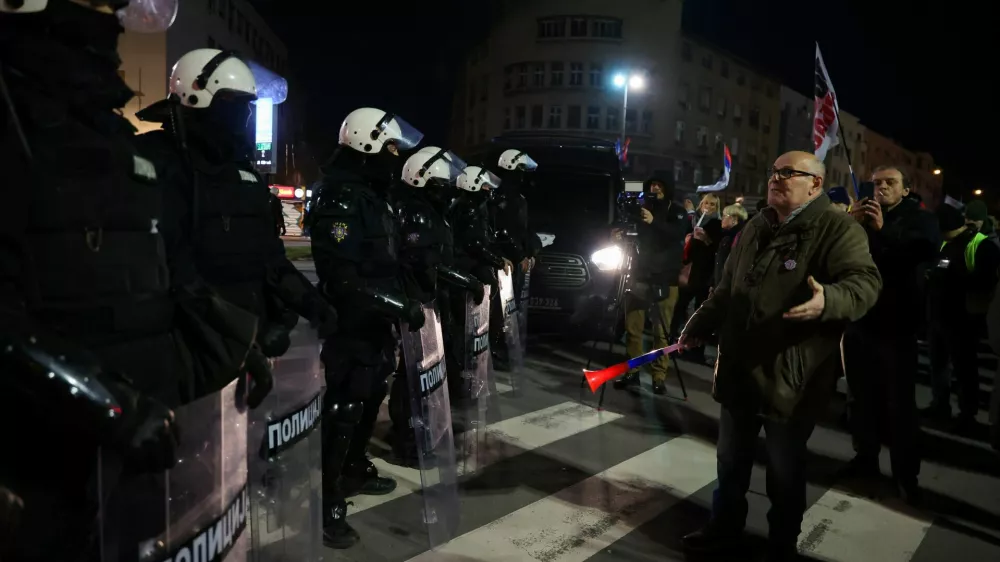 Police officers stand guard as students and their supporters gather to protest, as part of ongoing demonstrations sparked by the collapse of the Novi Sad railway station canopy in November 2024, coinciding with an official state ceremony attended by senior government officials marking the 200th anniversary of Serbia's oldest cultural and literary institution in the city centre,&nbsp;in Novi Sad, Serbia, February 16, 2026. REUTERS/Zorana Jevtic
