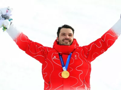 Milano Cortina 2026 Olympics - Alpine Skiing - Men's Slalom Victory Ceremony - Stelvio Ski Centre, Bormio, Italy - February 16, 2026. Gold medallist Loic Meillard of Switzerland celebrates on the podium during the men's slalom victory ceremony REUTERS/Denis Balibouse
