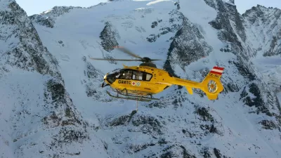 "Grossglockner, Austria - October 30, 2011: Rescue helicopter from Austrian Mountain Rescue Service flying at accident site at October 30, 2011. At 2001 Rescue Service performed a total of 6508 rescues."