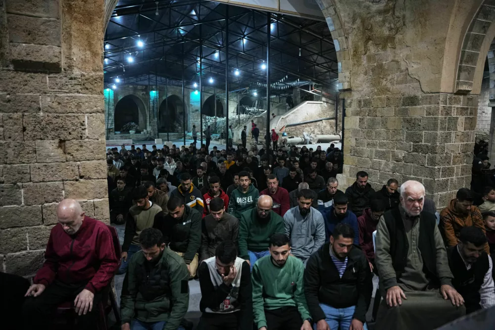 Muslim worshippers perform evening Tarawih prayer on the first night of the holy fasting month of Ramadan at the Great Omari Mosque, which was damaged during the Israel&ndash;Hamas war, in Gaza City, Tuesday, Feb. 17, 2026. (AP Photo/Abdel Kareem Hana)