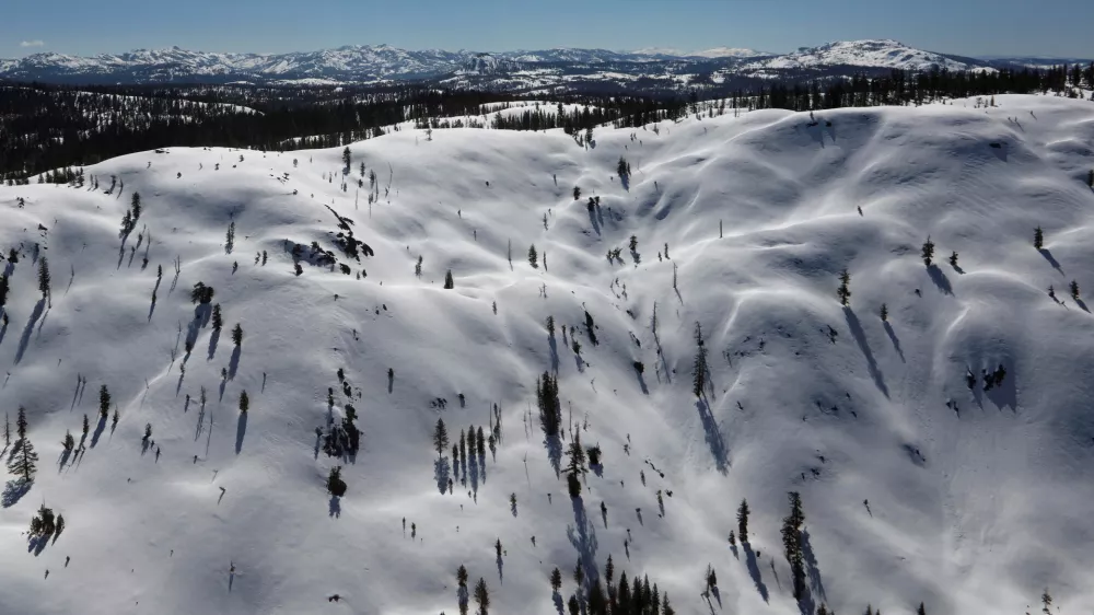 FILE PHOTO: The snow-covered Sierra Nevada Mountains are seen from the air during a Pacific Gas and Electric snowpack survey near Nevada City, California, U.S. April 3, 2017. REUTERS/Bob Strong/File Photo