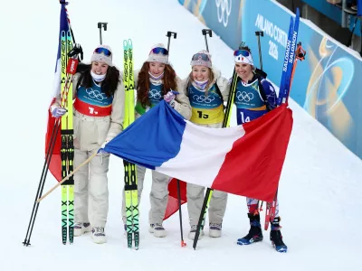 Milano Cortina 2026 Olympics - Biathlon - Women's 4 x 6km Relay - Anterselva Biathlon Arena, South Tyrol, Italy - February 18, 2026. Camille Bened of France, Lou Jeanmonnot of France, Oceane Michelon of France and Julia Simon of France celebrate after winning gold during the Women's 4 x 6km Relay. REUTERS/Eloisa Lopez