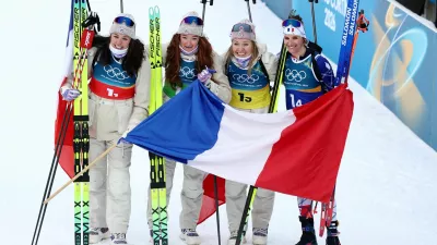 Milano Cortina 2026 Olympics - Biathlon - Women's 4 x 6km Relay - Anterselva Biathlon Arena, South Tyrol, Italy - February 18, 2026. Camille Bened of France, Lou Jeanmonnot of France, Oceane Michelon of France and Julia Simon of France celebrate after winning gold during the Women's 4 x 6km Relay. REUTERS/Eloisa Lopez