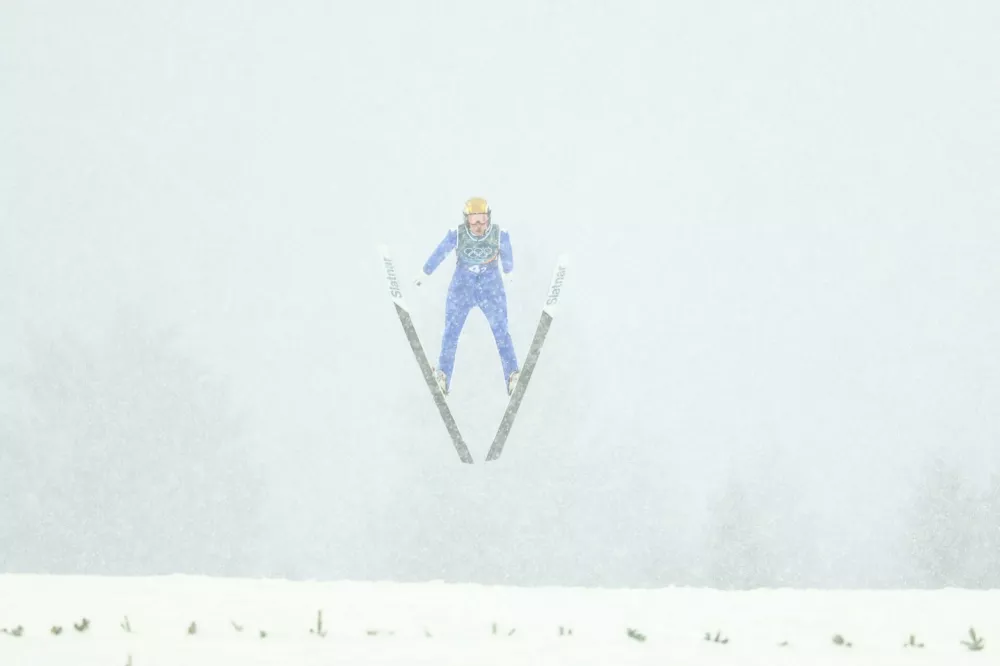 Milano Cortina 2026 Olympics - Nordic Combined - Team Sprint, Ski Jumping Trial Round - Predazzo Ski Jumping Stadium, Predazzo, Italy - February 19, 2026. Vid Vrhovnik of Slovenia in action during the ski jumping trial round REUTERS/Kai Pfaffenbach