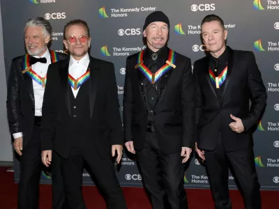 FILE - Adam Clayton, from left, Bono, The Edge and Larry Mullen Jr., of the Irish band U2, arrive at the Kennedy Center Honors in Washington on Dec. 4, 2022. (Photo by Greg Allen/Invision/AP, File)