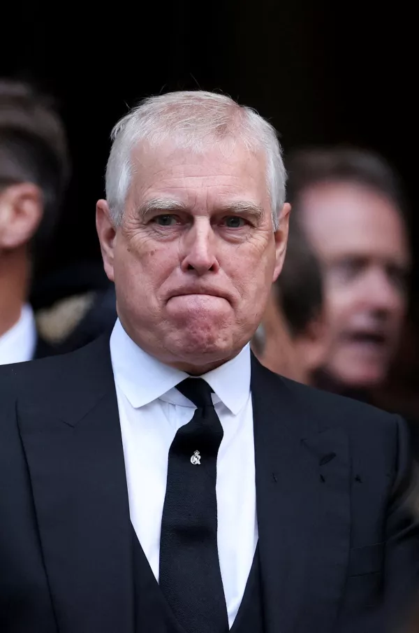 FILE PHOTO: Britain's Prince Andrew reacts at the end of the Requiem Mass, on the day of the funeral of Britain's Katharine, Duchess of Kent, at Westminster Cathedral in London, Britain, September 16, 2025. REUTERS/Toby Melville/File Photo