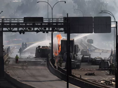 Firefighters work at the site of a deadly explosion, according to local media, in Santiago, Chile, February 19, 2026. REUTERS/Pablo Sanhueza