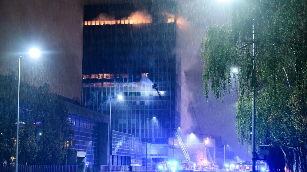 Firefighters work to extinguish the fire that caught 'Vjesnik' skyscraper, which used to accommodate most of Croatian media companies, in Zagreb, Croatia, early Tuesday, Nov. 18, 2025. (AP Photo/Damir Krajac)