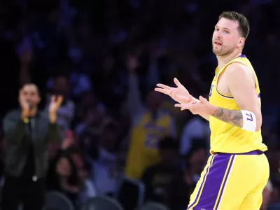 Los Angeles Lakers guard Luka Doncic gestures after scoring a 3-point basket against the Los Angeles Clippers during the first half of an NBA basketball game, Friday, Feb. 20, 2026, in Los Angeles. (AP Photo/Jessie Alcheh)