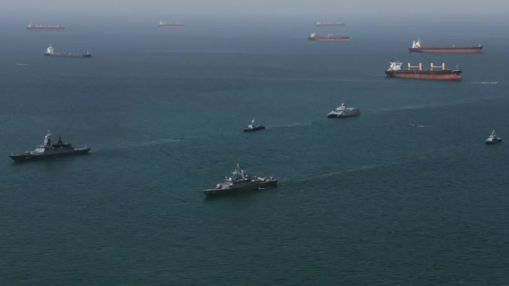 This image provided Thursday Feb. 19, 2026 by the Iranian military and dand dated Wednesday, Feb. 18, 2025, shows navy ships conducting operations during a join drill by Iranian and Russian forces in the Indian Ocean.(Masoud Nazari Mehrabi/Iranian Army via AP)