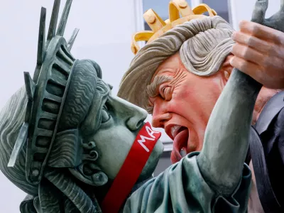 A carnival float depicts U.S. President Donald Trump and the Statue of Liberty with a "MAGA" gag across her mouth, at the traditional "Rosenmontag" Rose Monday carnival parade in Mainz, Germany, February 16, 2026. REUTERS/Heiko Becker  TPX IMAGES OF THE DAY