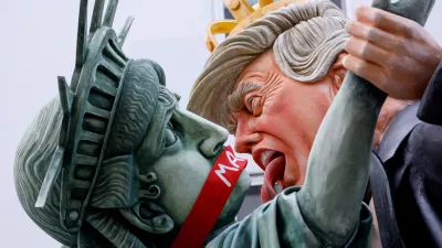 A carnival float depicts U.S. President Donald Trump and the Statue of Liberty with a "MAGA" gag across her mouth, at the traditional "Rosenmontag" Rose Monday carnival parade in Mainz, Germany, February 16, 2026. REUTERS/Heiko Becker  TPX IMAGES OF THE DAY
