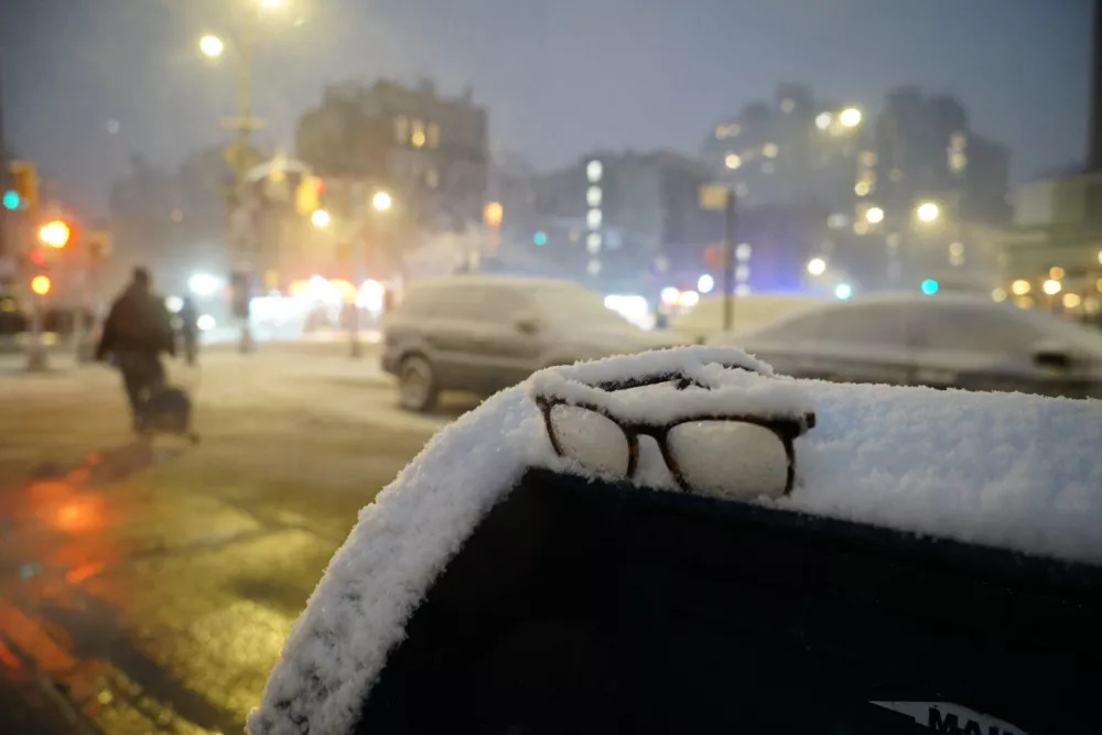 A pair of missing glasses sits in accumulated snow on top of a mailbox during a snowstorm, Sunday, Feb. 22, 2026, in New York. (AP Photo/Pamela Hassell)