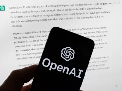FILE - The OpenAI logo is displayed on a mobile phone in front of a computer screen with output from ChatGPT, March 21, 2023, in Boston. (AP Photo/Michael Dwyer, File)
