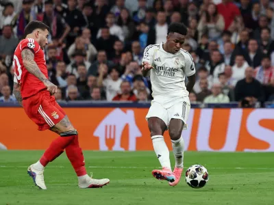 Soccer Football - UEFA Champions League - Play Off - Second Leg - Real Madrid v Benfica - Santiago Bernabeu, Madrid, Spain - February 25, 2026 Real Madrid's Vinicius Junior scores their second goal REUTERS/Violeta Santos Moura