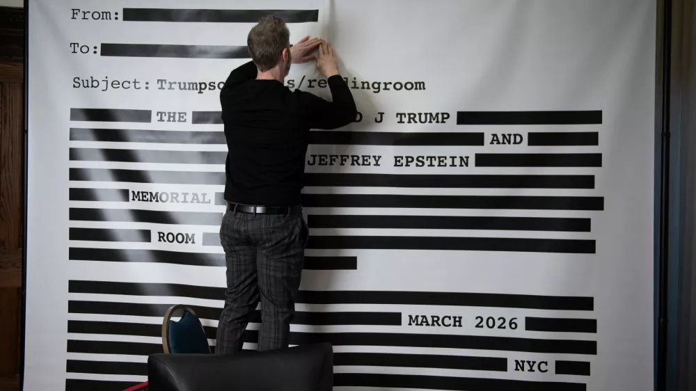 An "Epstein Reading Room" studio backdrop, of a redacted email, is set-up for guest photos during a rebuttal to President Donald Trump's State of the Union hosted by Defiance.org, the Portland Frog Brigade, and COURIER, at the National Press Club, in Washington, Tuesday, Feb. 24, 2026. (AP Photo/Cliff Owen)