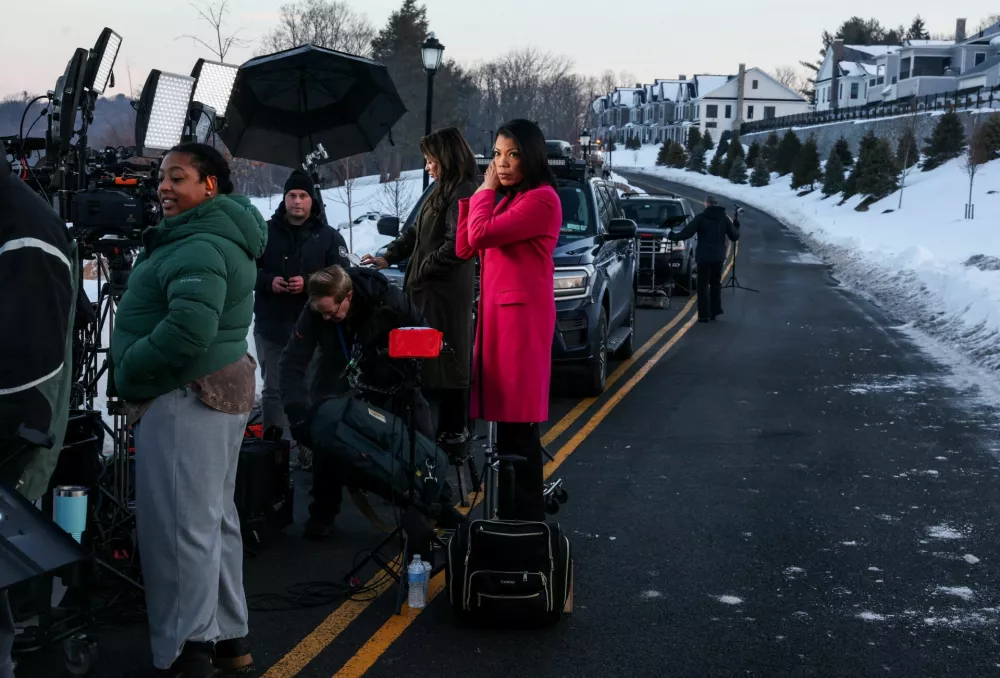 Members of the media gather outside the Chappaqua Performing Arts Center, ahead of former U.S. Secretary of State Hillary Clinton's appearance for a deposition in the House Oversight Committee investigation of late financier and convicted sex offender Jeffrey Epstein, in Chappaqua, New York, U.S., February 26, 2026. REUTERS/Shannon Stapleton TPX IMAGES OF THE DAY