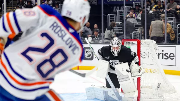 Edmonton Oilers center Jack Roslovic, left, shoots against Los Angeles Kings goaltender Anton Forsberg during the third period of an NHL hockey game Thursday, Feb. 26, 2026 in Los Angeles. (AP Photo/Ryan Sun)