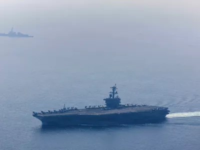 The U.S. Navy's Nimitz-class aircraft carrier USS Abraham Lincoln and Arleigh Burke-class guided-missile destroyer USS Frank E. Petersen Jr. sail during a photo exercise in the Arabian Sea, February 6, 2026. U.S. Navy/Mass Communication Specialist 1st Class Jesse Monford/Handout via REUTERS THIS IMAGE HAS BEEN SUPPLIED BY A THIRD PARTY