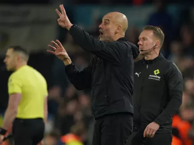 Manchester City's head coach Pep Guardiola reacts during the Premier League soccer match between Leeds United and Manchester City in Leeds, England, Saturday, Feb. 28, 2026. (AP Photo/Ian Hodgson)