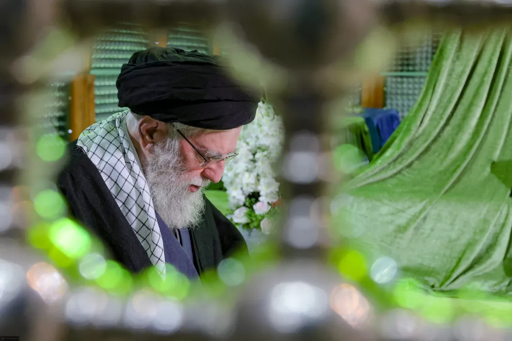 FILE - In this photo released by an official website of the office of the Iranian supreme leader, Supreme Leader Ayatollah Ali Khamenei prays at the grave of the late revolutionary founder Ayatollah Khomeini, commemorating the 47th anniversary of his return from exile during the 1979 Islamic Revolution, just outside Tehran, Iran, Jan. 31, 2026. (Office of the Iranian Supreme Leader via AP, File)