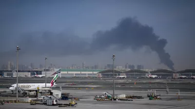 Emirates airplanes are parked at the Dubai International Airport after its closure in Dubai, United Arab Emirates, Sunday, March 1, 2026. (AP Photo/Altaf Qadri)