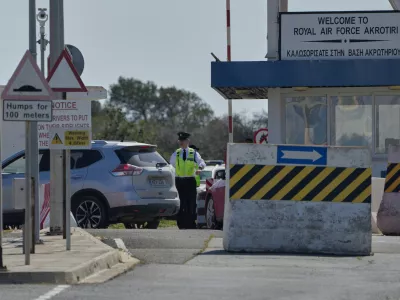 A Force Protection personnel inspects a vehicle at the main gate of the U.K.'s RAF Akrotiri air base after it was hit by a drone strike early morning near Limassol, Cyprus, Monday, March, 2, 2026. (AP Photo/Petros Karadjias)