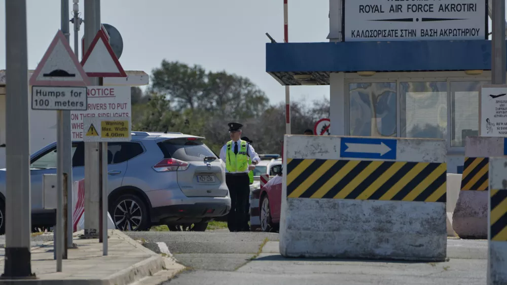 A Force Protection personnel inspects a vehicle at the main gate of the U.K.'s RAF Akrotiri air base after it was hit by a drone strike early morning near Limassol, Cyprus, Monday, March, 2, 2026. (AP Photo/Petros Karadjias)