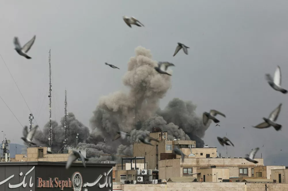 Birds fly as smoke rises following an explosion, after Israel and the U.S. launched strikes on Iran, amid the U.S.-Israel conflict with Iran, in Tehran, Iran, March 2, 2026. Majid Asgaripour/WANA (West Asia News Agency) via REUTERS ATTENTION EDITORS - THIS PICTURE WAS PROVIDED BY A THIRD PARTY