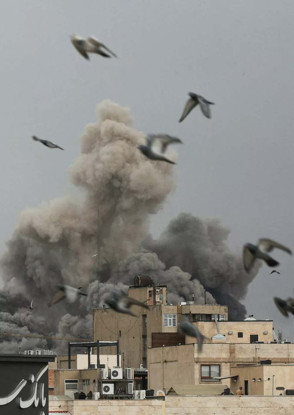 Birds fly as smoke rises following an explosion, after Israel and the U.S. launched strikes on Iran, amid the U.S.-Israel conflict with Iran, in Tehran, Iran, March 2, 2026. Majid Asgaripour/WANA (West Asia News Agency) via REUTERS ATTENTION EDITORS - THIS PICTURE WAS PROVIDED BY A THIRD PARTY