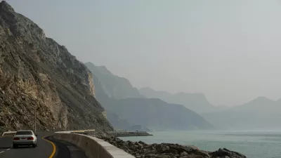 A car rides along the coast of Musandam overlooking the Strait of Hormuz amid the U.S.-Israeli conflict with Iran, Oman, March 2, 2026.REUTERS/Amr Alfiky   TPX IMAGES OF THE DAY
