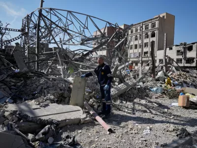 An electricity utility worker inspects the ruins of a police facility struck during the U.S.&ndash;Israeli military campaign in Tehran, Iran, Wednesday, March 4, 2026. (AP Photo/Vahid Salemi)